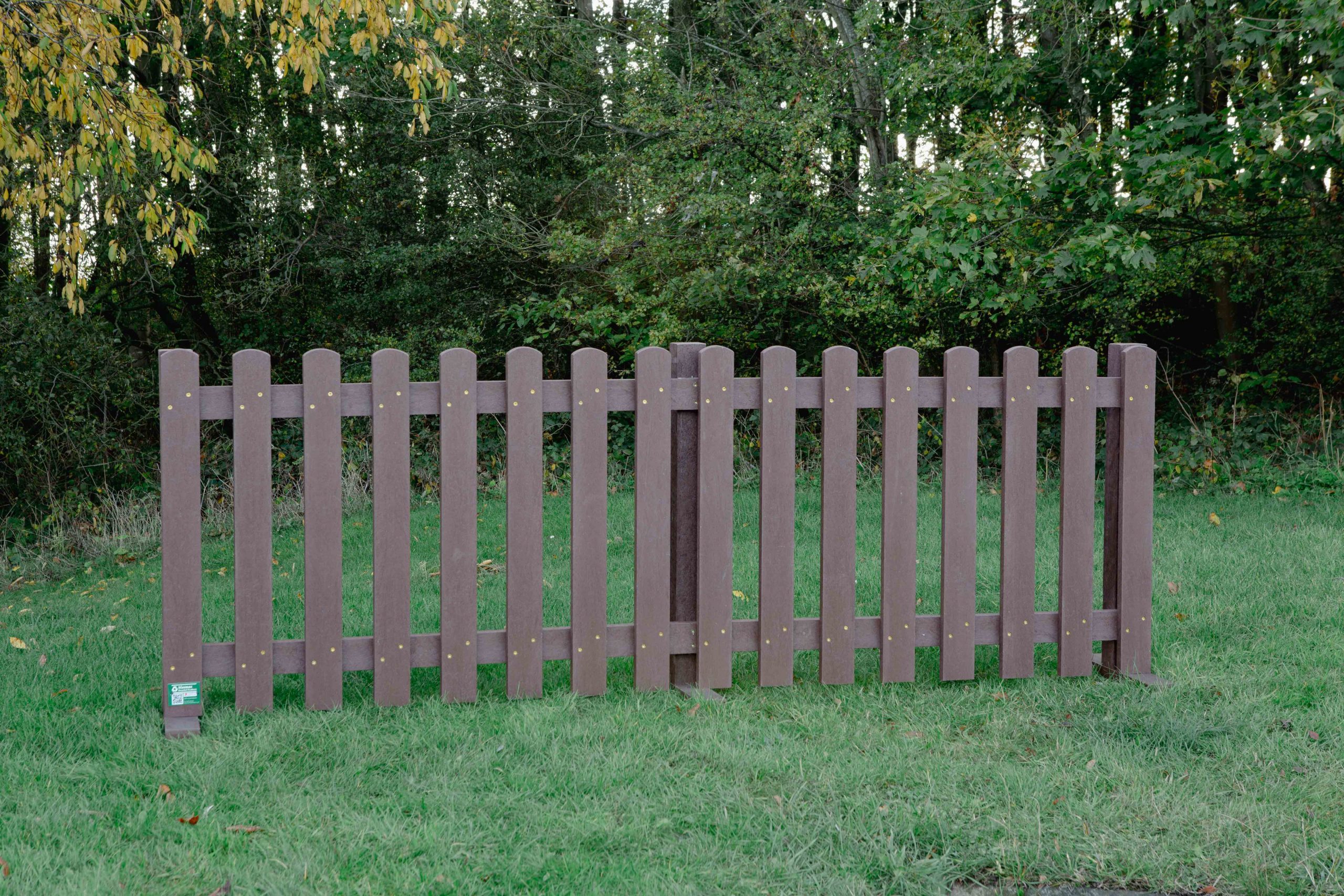 Picket Fencing Brown Brown Picket Fencing on grass