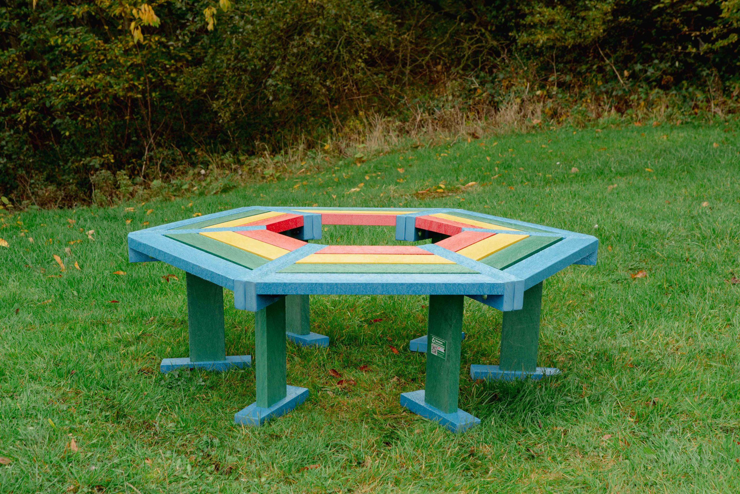 Beamish Tree Seat Hexagonal Rainbow Beamish Tree Seat Hexagonal Rainbow on grass