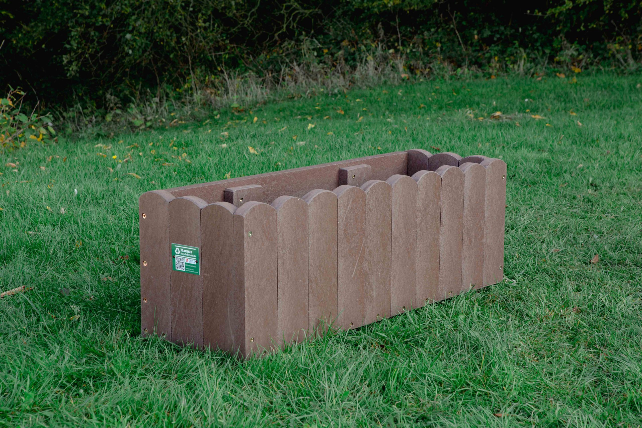 Brown coloured Window Box on grass