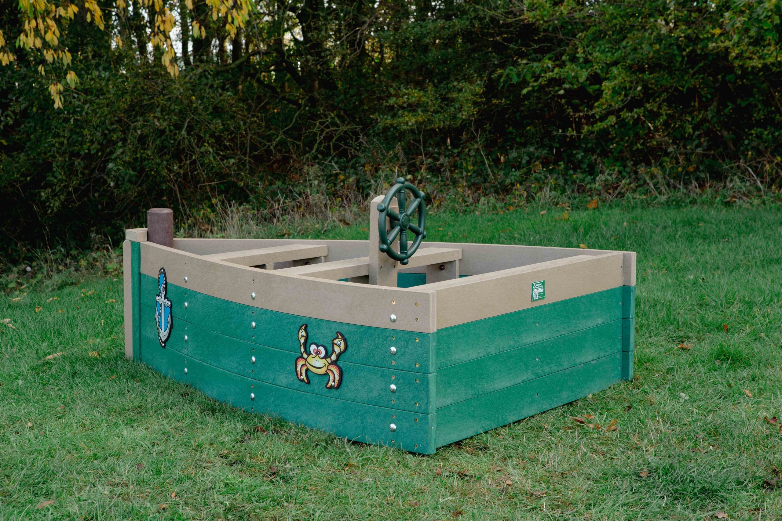 green and beige Small Boat on grass